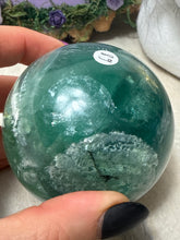 Load image into Gallery viewer, Feather Snowflake Fluorite Sphere
